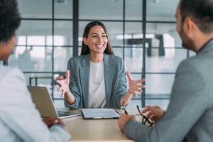 Business professional forming connection with happy clients