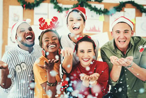 Employees celebrating the holidays together in an office