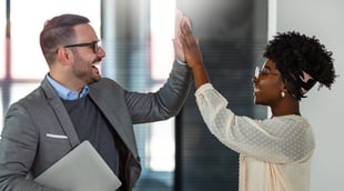 Business owner high-fiving employee