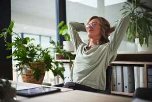 Employee relaxing at her desk