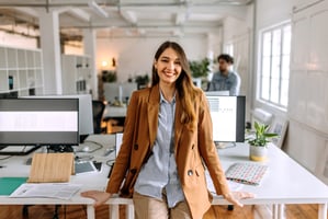 Smiling Gen Z employee in the office