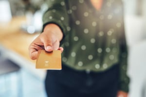 Person holding out a gift card