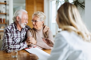 Senior couple working with Medicare administrator