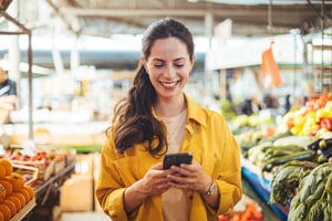 Scrip recipient doing grocery shopping with nonprofit gift card