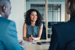 Healthcare HR professional speaking with employees