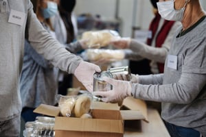 Volunteers giving food and resources to fire disaster victims