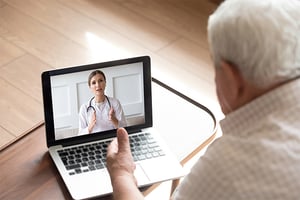 Medicaid/Medicare member speaking with doctor on laptop video call