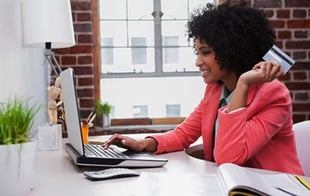 woman shopping online at desk