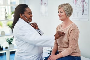 Healthcare provider performing health screening with Medicare patient